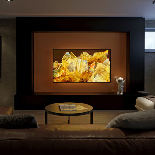 Modern media room with large flat-screen TV, cozy seating, and warm ambient lighting for an upgraded entertainment space.