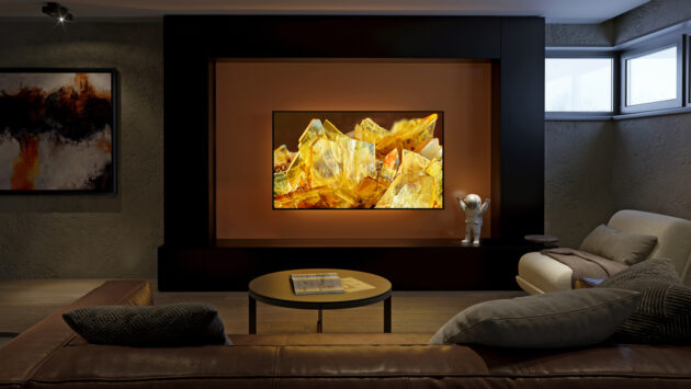 Modern media room with large flat-screen TV, cozy seating, and warm ambient lighting for an upgraded entertainment space.