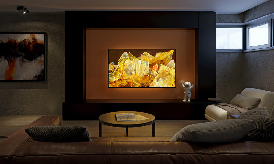 Modern media room with large flat-screen TV, cozy seating, and warm ambient lighting for an upgraded entertainment space.