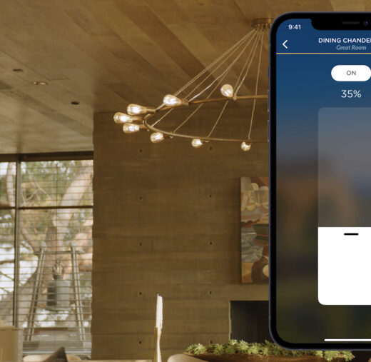A smartphone displaying the Josh.ai lighting control interface, layered over an image of a modern living space.